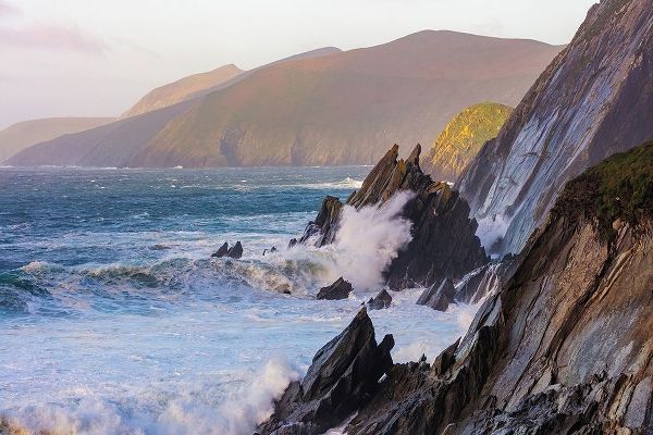 Waves crash into cliffs on Dunmore Head with Blasket Islands on the Dingle Peninsula-Ireland